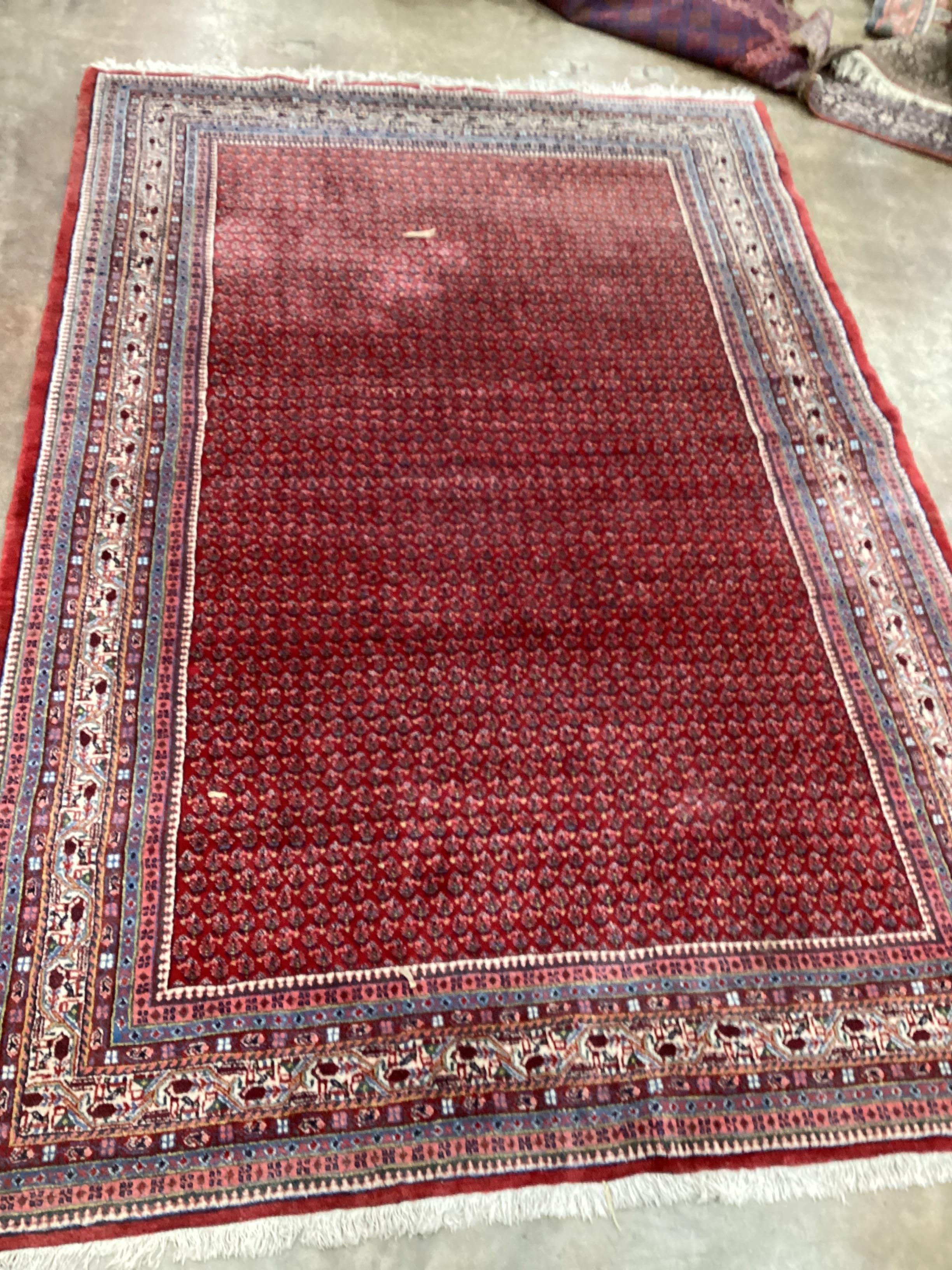 A Sarouk Mir red ground carpet, 288 x 191cm